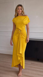 Full front view of model wearing the yellow asymmetrical drape maxi dress