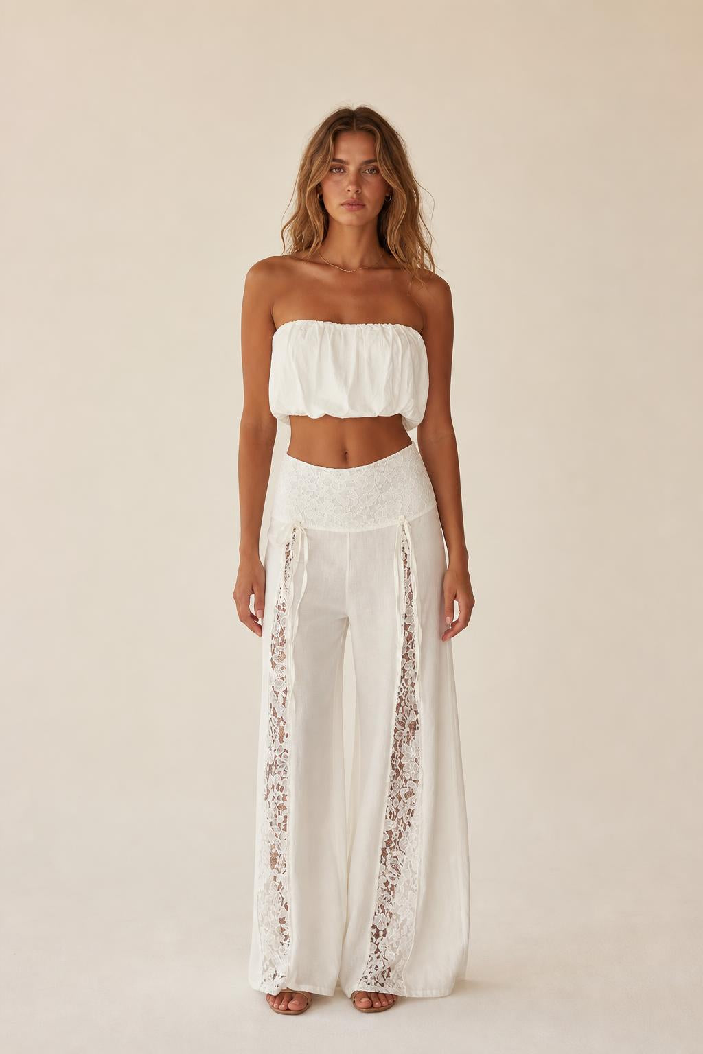 Front view of the white boho lace panel tube top and wide leg pants set