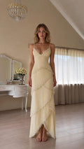 Front view of yellow pearl-embellished tiered maxi dress