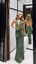 Model wearing sage green leopard print halter cowl neck maxi dress