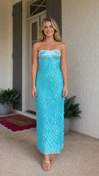 Front view of model wearing turquoise strapless sequin maxi dress