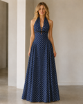 Front view of navy polka dot halter backless maxi dress