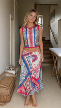 Front view of model wearing blue boho printed crop top and midi skirt set