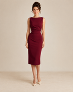 Front view of burgundy sleeveless ruched waist midi sheath dress with boat neckline