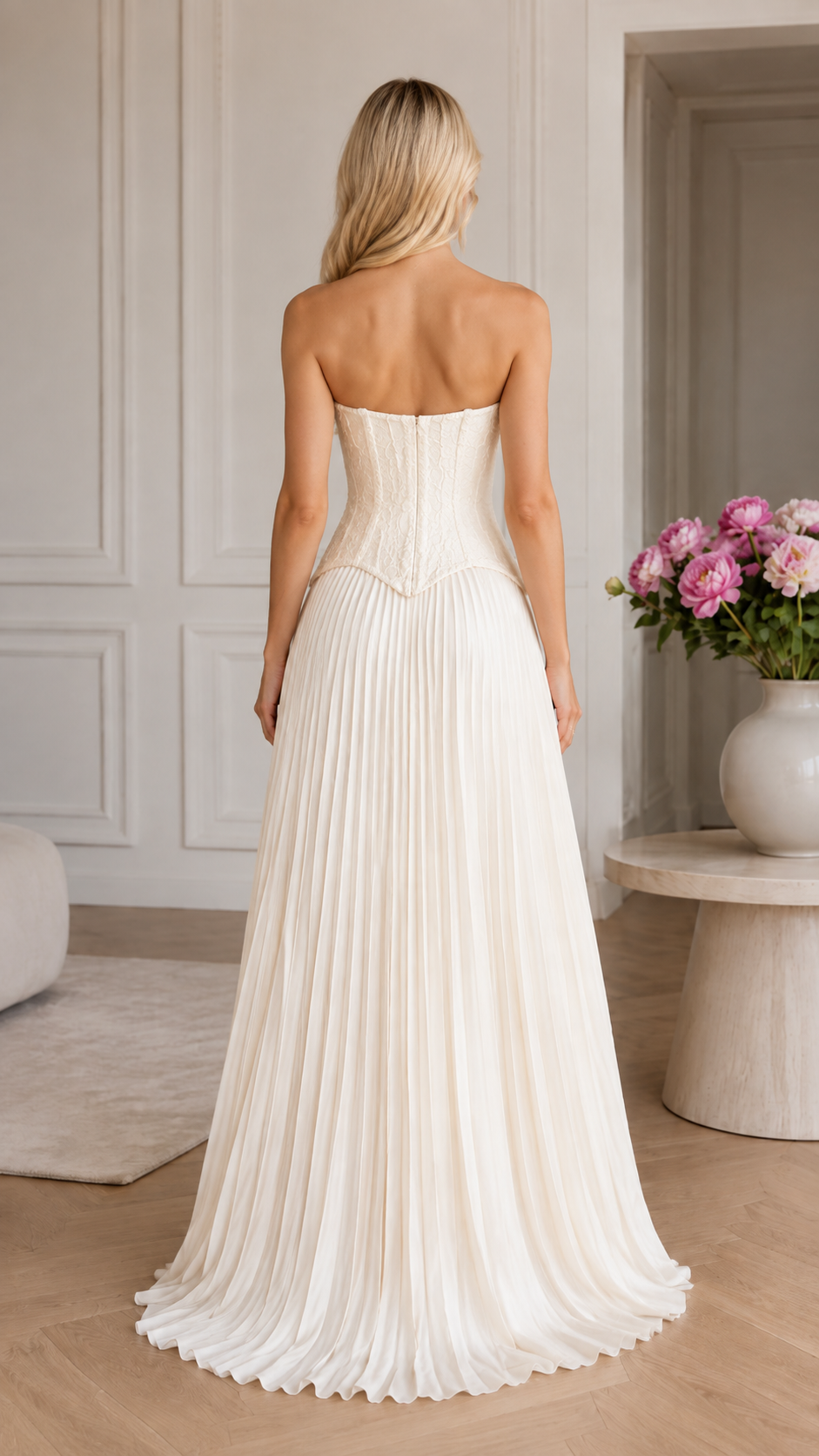 Back view of white strapless pleated long gown