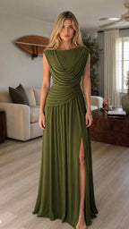 Front view of model wearing olive green draped cowl neck maxi dress with slit