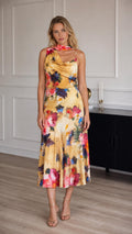 Model wearing yellow floral print satin midi dress from the front