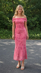 Model wearing pink off-the-shoulder ruched floral midi dress, front view