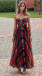 Front view of model wearing multi-color pleated strapless maxi dress