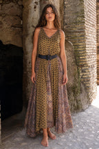 Front view of woman wearing mustard boho printed maxi dress with belt