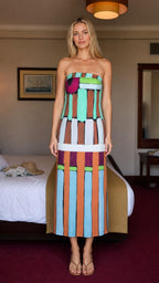 Front view of woman wearing abstract colorblock strapless maxi dress