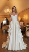 Front view of white strapless ruffle evening gown
