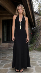Front view of black halter neck maxi dress on model