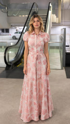Front view of woman wearing pink floral jacquard maxi shirt dress