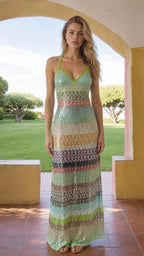 Model wearing Multi Green striped sequin halter maxi dress, front view