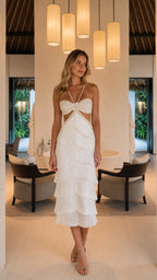 Front full view of woman wearing white halter cut-out tiered fringe midi dress