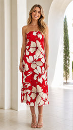 Front view of woman wearing red and white floral strapless midi dress
