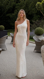 Front view of model wearing white one-shoulder floral applique maxi dress