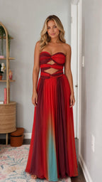 Front view of the red strapless cutout pleated maxi dress