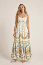 Front view of cream floral maxi dress on model
