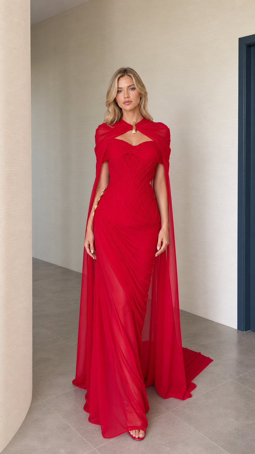 Front view of model wearing red cape maxi evening dress