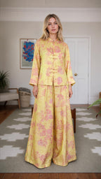 Front view of woman wearing yellow floral brocade two-piece set