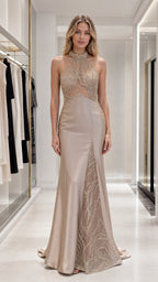 Front view of champagne embellished halter neck evening dress