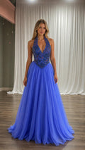 Front view of blue halter neck tulle evening gown