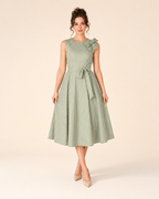Front view of sage sleeveless striped midi dress with shoulder bow and tie waist