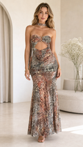 Model wearing multi rust animal print strapless cutout maxi dress front view