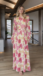 Front view of yellow floral print long sleeve cutout maxi dress