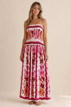 Front view of floral print smocked maxi dress in white