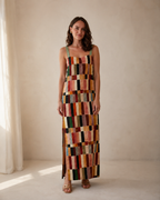 Front view of multicolor patchwork-style sleeveless square neck maxi dress with side slit