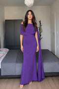Model wearing purple off-shoulder cape maxi dress front view