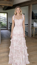 Front view of model wearing pink floral tiered maxi dress