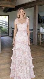 Front view of model wearing pink floral tiered maxi dress