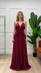 Front view of burgundy halter pleated maxi dress