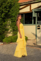 Side profile view of yellow evening gown