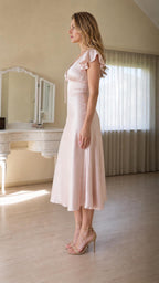 Side view of pink satin midi dress