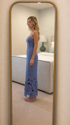 Side profile view of periwinkle strapless maxi dress