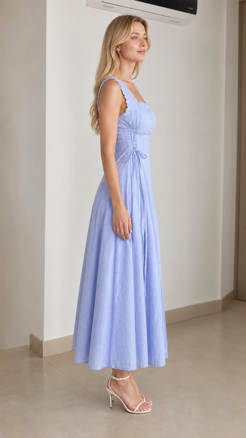 Side profile of model in light blue midi dress with lace-up waist