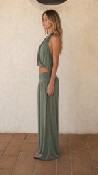 Side view of woman wearing sage green two-piece lounge set