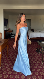 Angled front view of sky blue strapless satin-look maxi dress