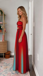 Side profile of the red pleated evening gown