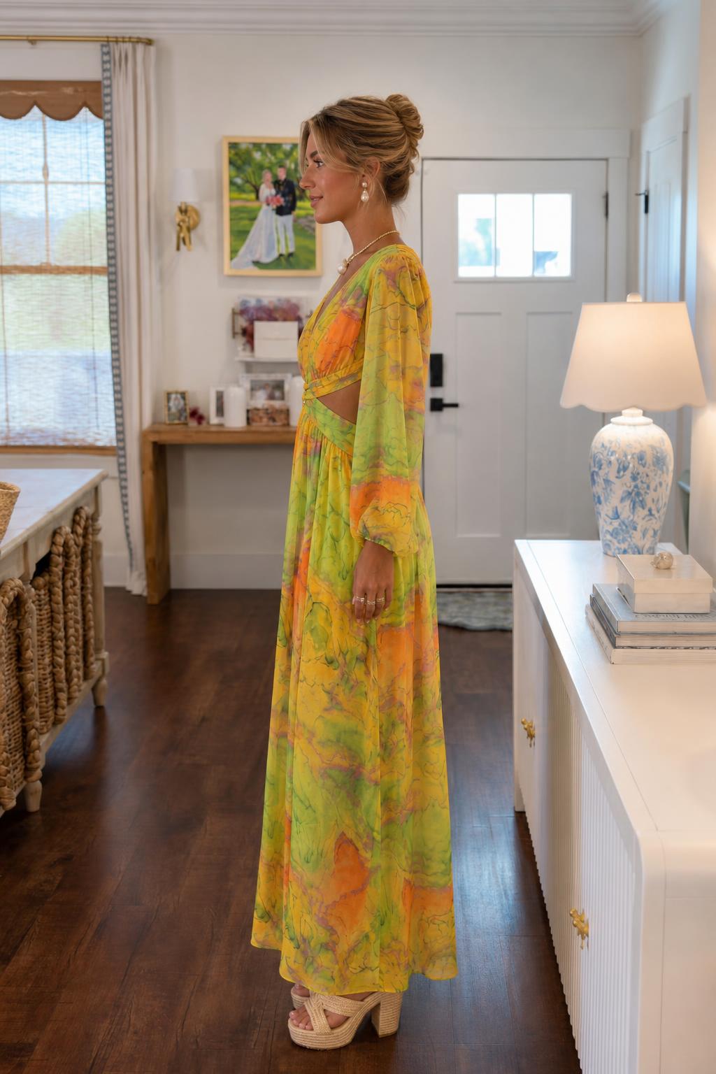 Side profile view of yellow multi maxi dress