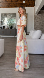 Side profile of model in multi-color floral two-piece set