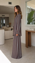 Model wearing brown striped two-piece set side view