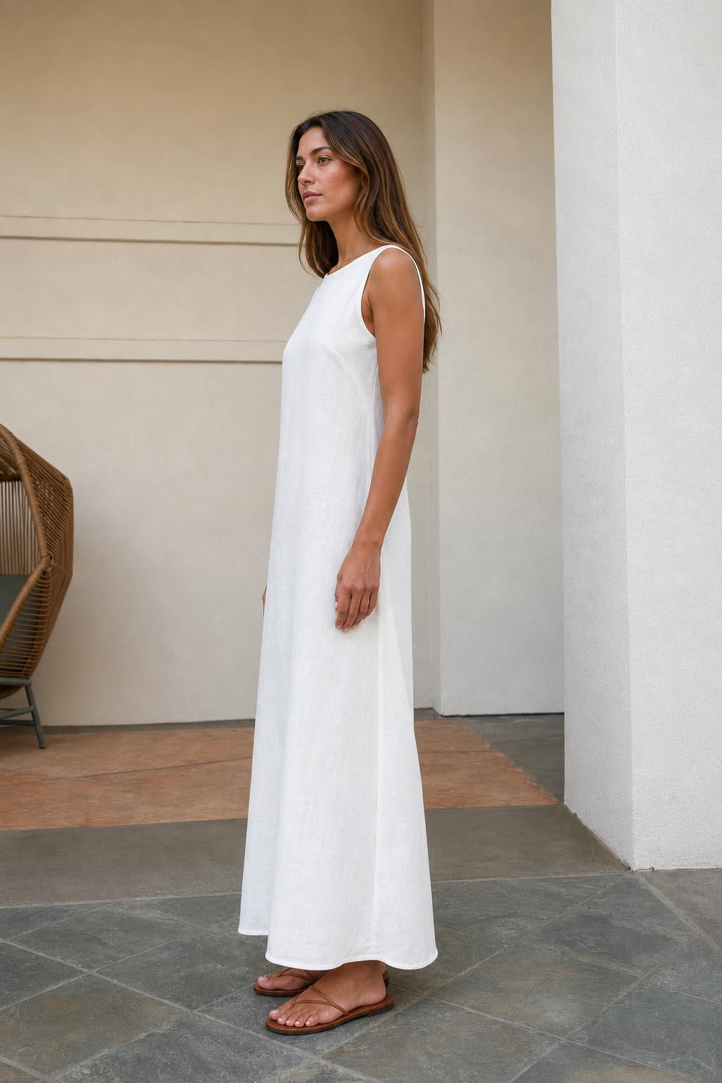 Side profile of woman in white maxi dress showing relaxed fit