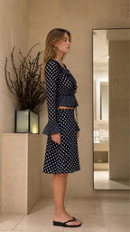 Side profile view of Navy Blue polka dot matching set