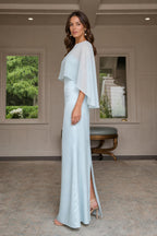Model wearing light blue evening gown showing side slit and profile